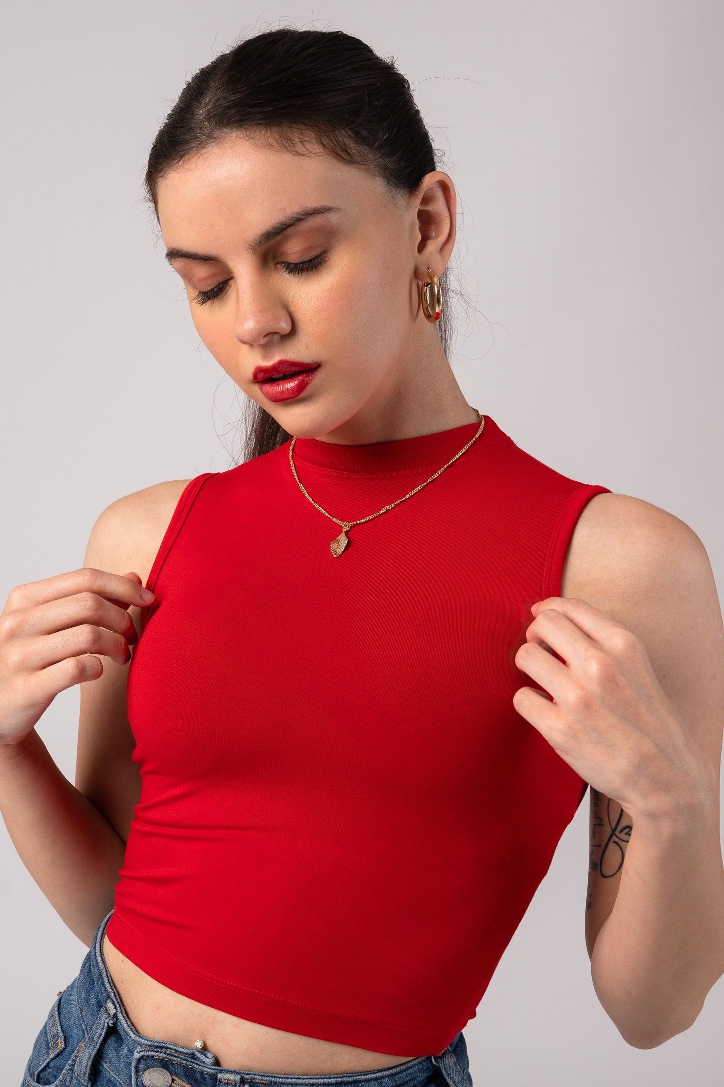 Sleeveless High Neck Crop Top with in built bra padding